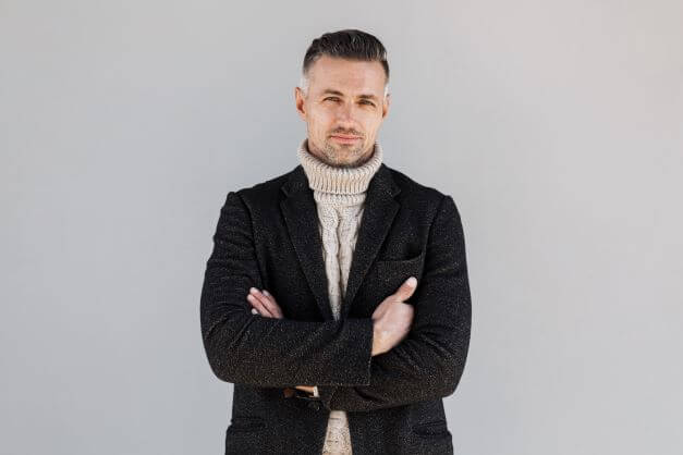 How To Pull Off The Smart Casual Look For Men 3 man in knitwear and coat