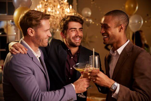 What is cocktail attire (and how to pull it off)? 2 men in cocktail attire