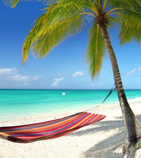 How To Create A Stress-Free Luxury Holiday Experience To The Caribbean 8 hammock on a beach in the Caribbean