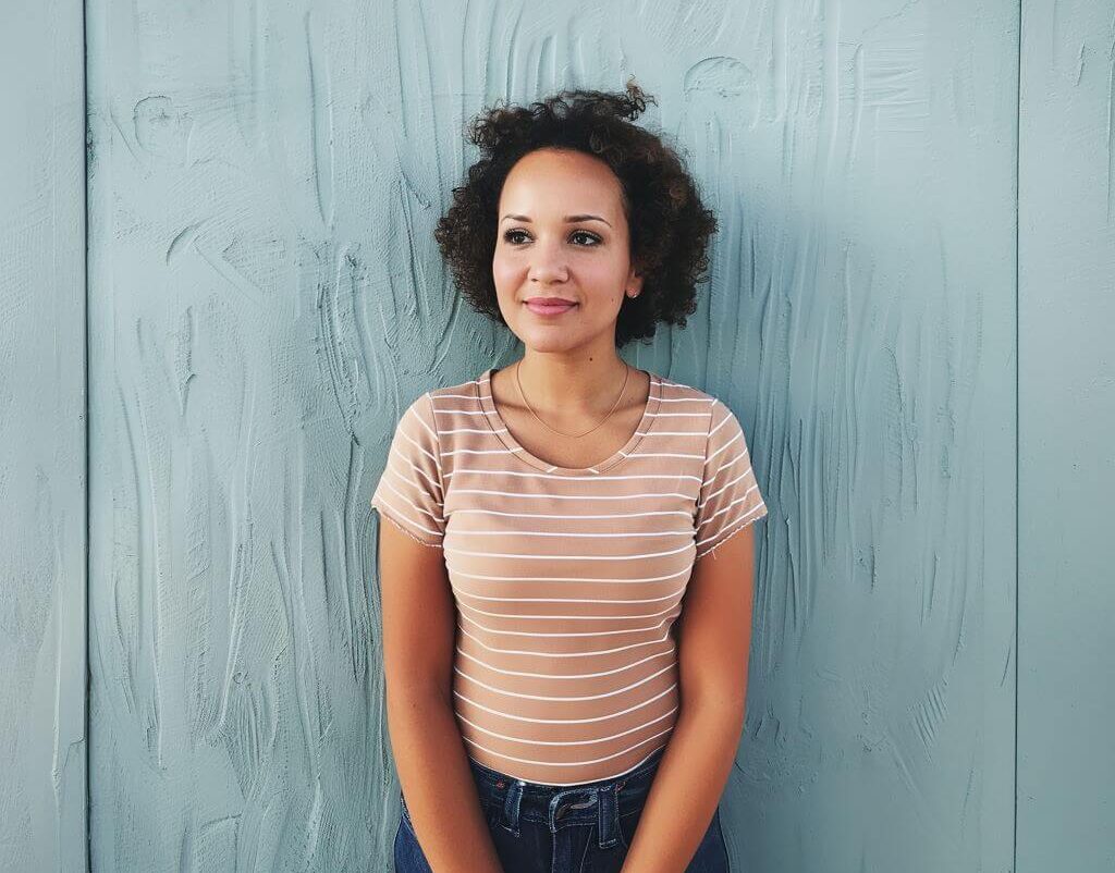 Jojo in a Breton stripe tee and jeans e1713536632881