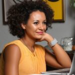 How to Settle into a Remote Job: A UK Guide for 2025 9 jojo working at her laptop