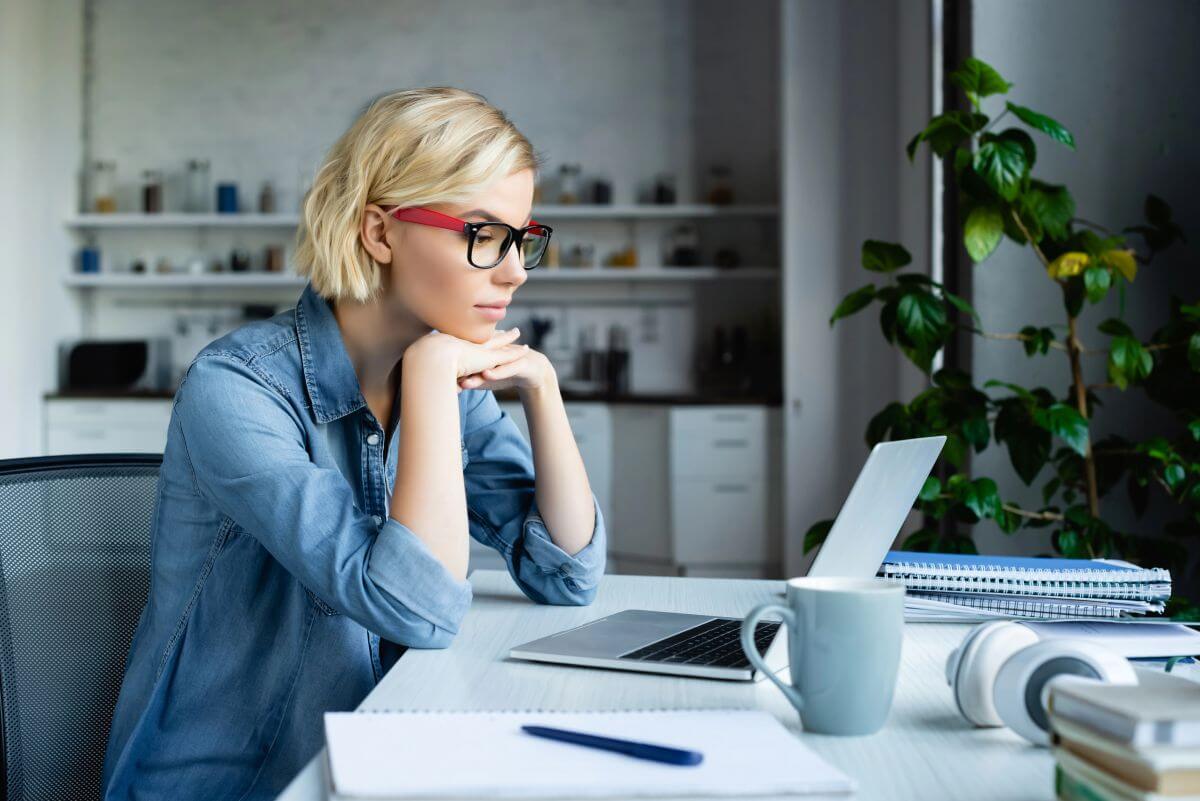 How to Settle into a Remote Job: A UK Guide for 2025 3 working from home on dining room table